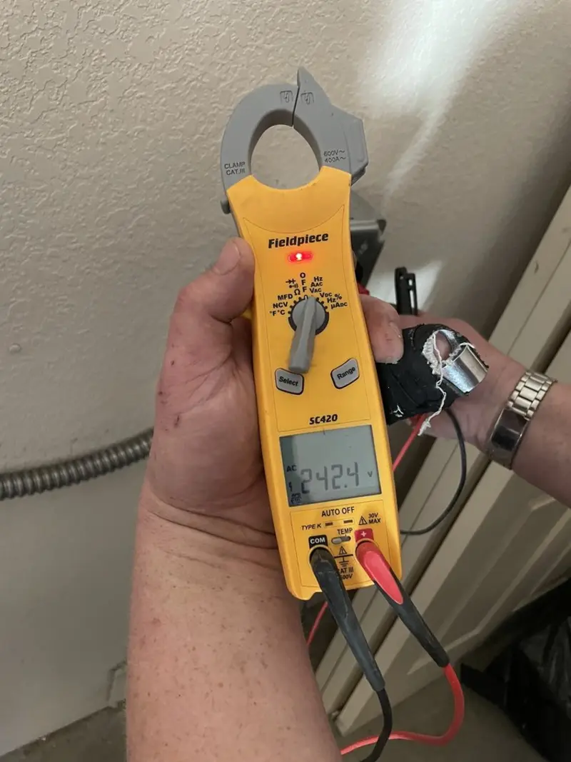 Voltage testing with clamp meter during Generator Installation in North Muskegon